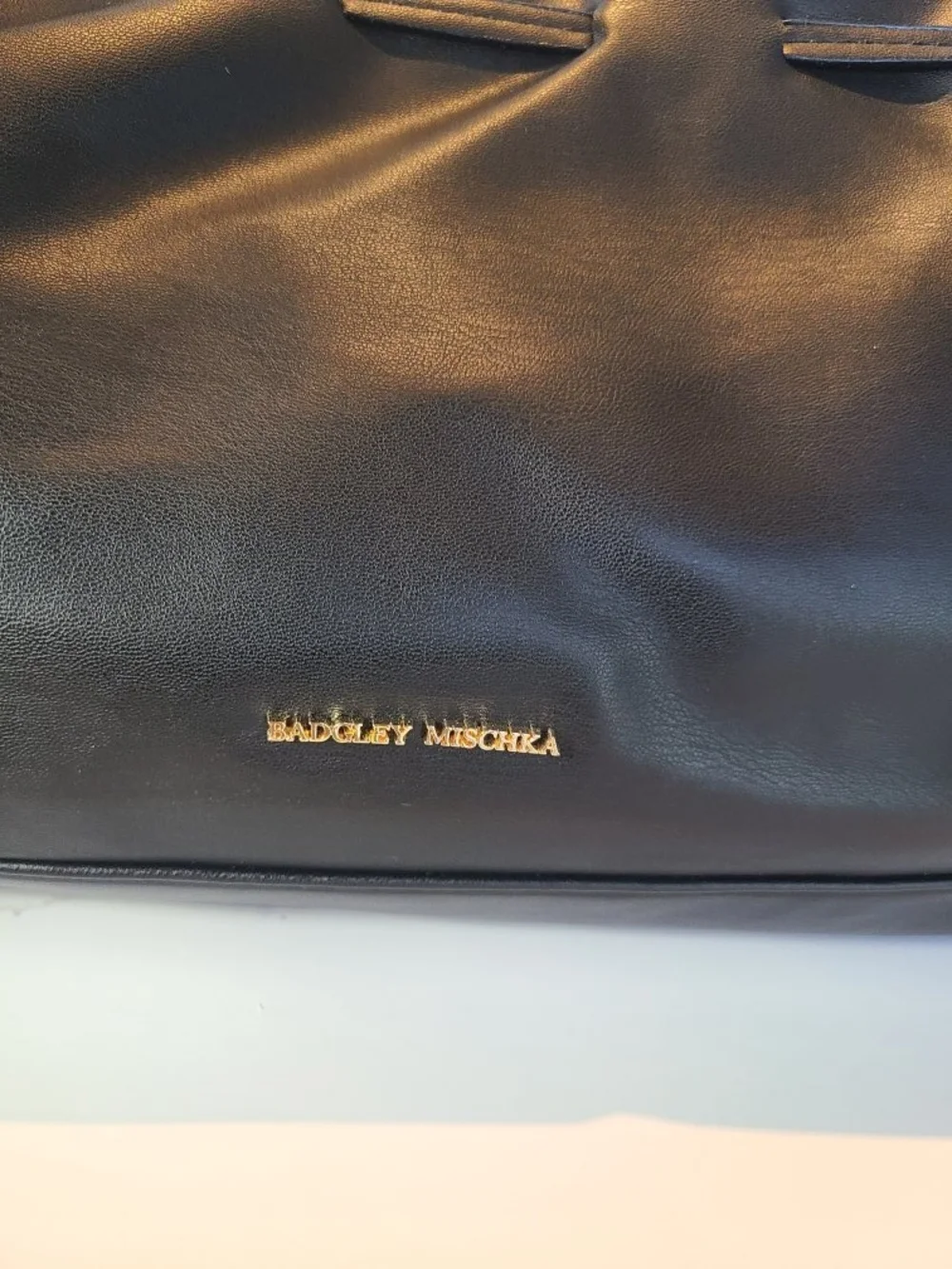 Badgley Mischka Black Leather Dumpling Bag with Drawstring and Gold Logo